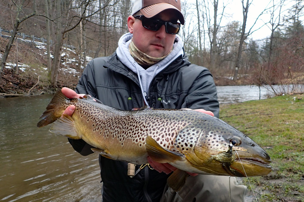 Man with Large Brown Trout